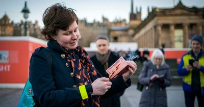 Woman sets fire to Russian passport at Scots demonstration protesting Ukraine invasion
