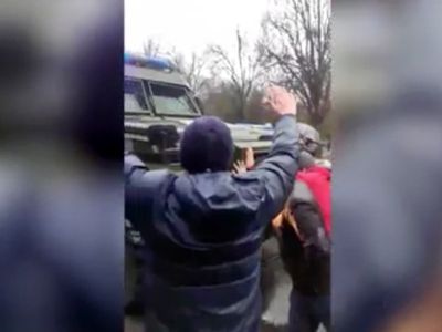 ‘Go home’: Dozens of brave Ukrainians block army convoy as Russian soldier fires shots into air