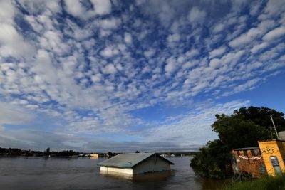 Australians flee floods as toll rises to 12, Sydney on alert