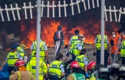 Fires and clashes at New Zealand parliament after police break up anti-vaccine mandate protest