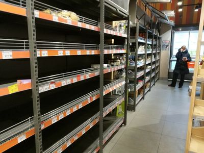 Empty shelves, spy hunt: Kyiv residents brace for Russian assault