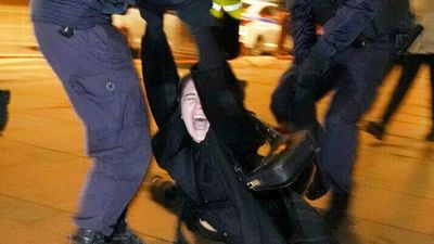 Photos show devastation as Russian invasion of Ukraine prompts condemnation across the globe