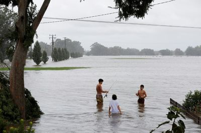 Australia orders 200,000 to flee floods, city of Sydney spared