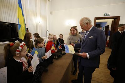 Schoolgirl hands Prince Charles ‘Stop Putin’ poster during emotional visit to Ukrainian church