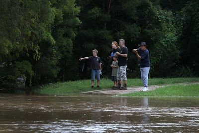 Half a million Australians told to evacuate or given flood warnings amid torrential rain
