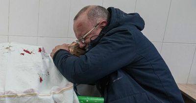 Weeping Ukrainian cradles body of son killed in Putin's Russian army air raids