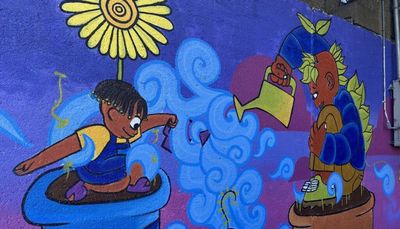 In Izze Ortiz’s Hyde Park mural, the people are either plants or a seed. Here’s why.