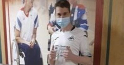 Flare lit next to disabled Swansea City fan leaves him with severe burns