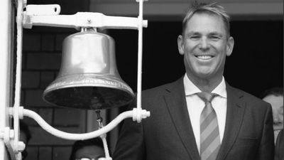 English fans at Lord's Cricket Ground raise a glass to Shane Warne