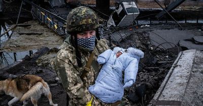 Heartbreaking moment baby carried from rubble as Russian shells pummel city