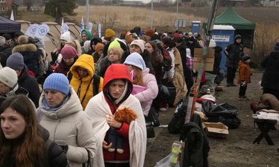 ‘We understand what war means’: Poles rush to aid Ukraine’s refugees