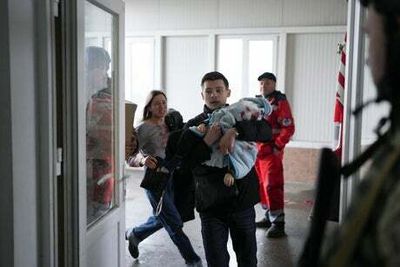 Parents weep after toddler is killed in Mariupol shelling