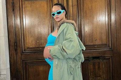 Rihanna shows off baby bump at Paris Fashion Week