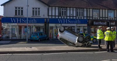 Car crashed into WHSmith window and another left overturned