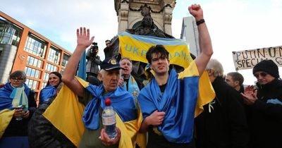 Emotional moment Ukrainian man completes marathon for family back home as protesters cheer in Piccadilly Gardens