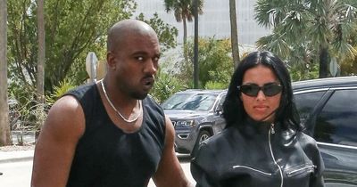 Kanye West gropes girlfriend in PDA-filled day out as he 'tries to make Kim jealous'