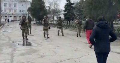 Unarmed Ukrainians bravely walk up to Russian soldiers in street to say 'go home!'