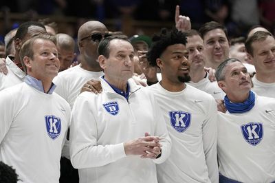 Duke fans go wild as Coach K takes the floor through a tunnel formed by former Blue Devils stars