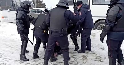 Russian protester hauled to ground and beaten by police as 3,500 people arrested