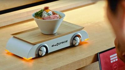 Nissan Demonstrates Ariya E-4ORCE's Smoothness Using A Ramen Robot