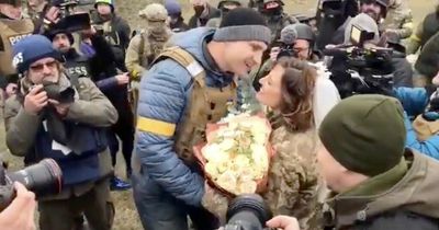 Vitali Klitschko kisses bride as brave couple get married on Kiev front line