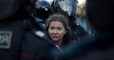 Russian cop boasts 'Putin is on our side' as he savagely beats anti-war protester