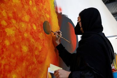 In Greek migrant camp, Afghan woman finds strength in art