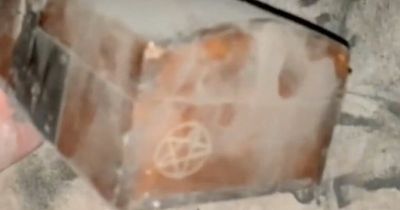 Man finds mystery box inside wall with 'do not release' carved into it