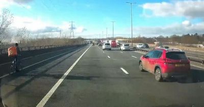 Video shows 'Just Eat' cyclist riding down busy M6 alongside 70mph cars