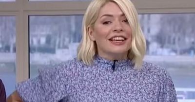 Holly Willoughby giggles as she's caught pulling up her Spanx on This Morning