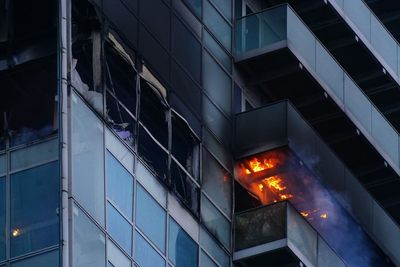 Woman rescued from fire at high-rise block of flats and offices in east London