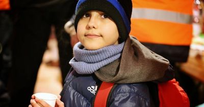 The boy 'hero', 11, who fled Ukraine alone with a backpack, his passport and a phone number written on his hand