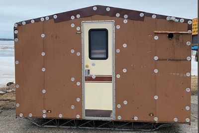 Ice-fishing shanty blown across Michigan bay; anglers safe