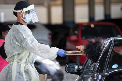 As virus cases go from 1 to 24,000, New Zealand changes tack