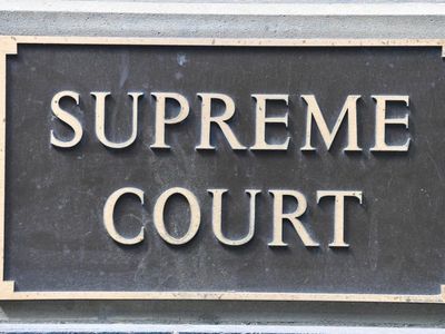 Man accused of shooting woman outside tent