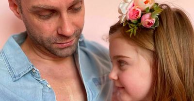 Devoted dad surprises little girl with tattoo of open-heart surgery scar like hers