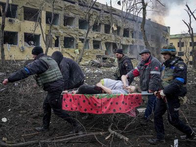 Ukraine news – live: US warns of chemical attack as Zelensky says bombing of children’s hospital is ‘genocide’