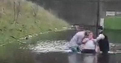 Man baptised in floodwater at roundabout in ceremony dubbed 'meant to be'