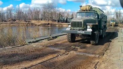 VIDEO: Russian Ministry Says Video Shows Armored Vehicles Crossing River Over Makeshift Bridge