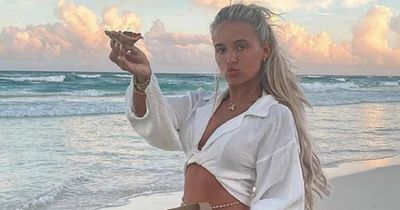 Molly-Mae hailed 'role model for all' by proud Tommy Fury as she shares snaps of herself eating pizza on the beach