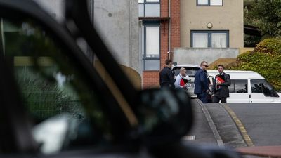 Man found dead in Harrington Street home near Hobart CBD, woman charged