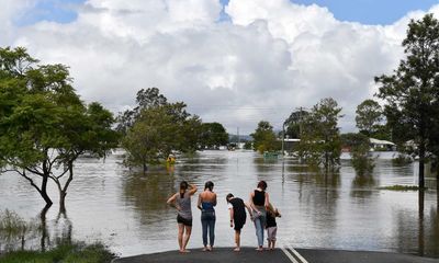 What are conservative commentators saying about the floods and climate?