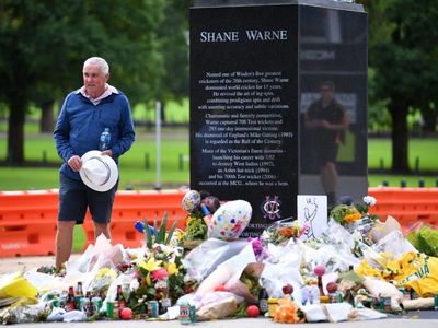 Shane Warne arrives home