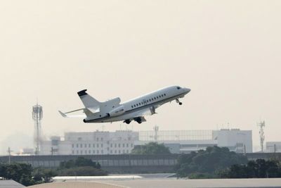 Shane Warne's body on flight to Australia