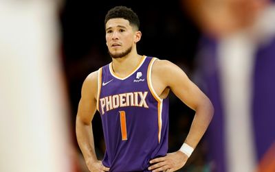 Booker stars as Suns beat Heat to seal NBA playoff berth