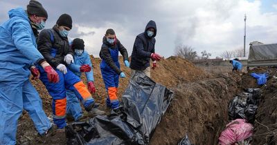 Dead Ukrainians dumped in mass graves in horror images as Russians besiege Mariupol