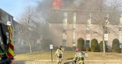 Dramatic moment firefighters shout 'drop the baby' out window of burning building