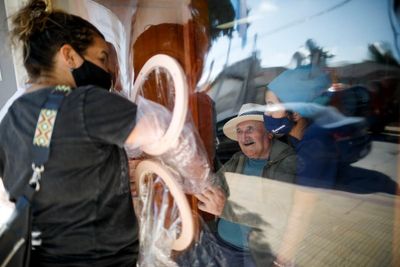 Two grueling years later, world takes cautious steps forward