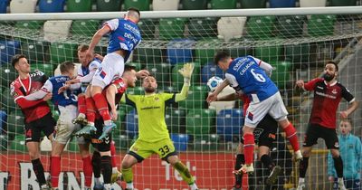 Linfield 3 Crusaders 2: Devine intervention as Blues snatch crucial victory at Windsor