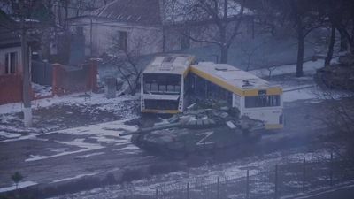 Russian tank attacks Mariupol apartments as new satellite images show scale of devastation